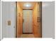 Interior elevator with traditional metal folding door at 45 Birnham Ln, Durham, NC 27707