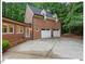 Charming brick home with a two-car garage, well-manicured landscaping, and inviting curb appeal in a serene setting at 45 Birnham Ln, Durham, NC 27707