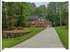 Beautiful two-story home with an attached garage and a long driveway surrounded by trees at 45 Birnham Ln, Durham, NC 27707