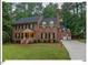 Charming brick two-story home with dormer windows, attached garage and well manicured lawn at 45 Birnham Ln, Durham, NC 27707