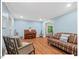 Cozy living room with hardwood floors, comfortable seating, and plenty of natural light at 45 Birnham Ln, Durham, NC 27707