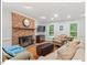 Comfortable living room with a brick fireplace, hardwood floors, and natural lighting at 45 Birnham Ln, Durham, NC 27707