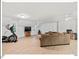 Spacious living room boasts a comfortable sofa, exercise equipment, wood floors, and plenty of natural light at 45 Birnham Ln, Durham, NC 27707