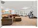 Cozy living room features a comfortable sofa, wood floors, and plenty of natural light from the large windows at 45 Birnham Ln, Durham, NC 27707