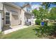 This backyard view includes an open patio, lawn, exterior of the home, and landscaping at 4807 Landover Charge Ln, Raleigh, NC 27616