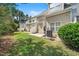View of the backyard showing a well-maintained lawn, patio and partial view of the home's exterior at 4807 Landover Charge Ln, Raleigh, NC 27616
