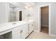 Bright bathroom featuring double vanity, large mirror, tile floors, and walk-in closet at 4807 Landover Charge Ln, Raleigh, NC 27616