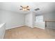 Upstairs bedroom with ceiling fan and carpeted floors at 4807 Landover Charge Ln, Raleigh, NC 27616