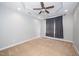 Cozy bedroom with tray ceilings, ceiling fan, recessed lights, and neutral carpet at 4807 Landover Charge Ln, Raleigh, NC 27616