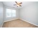 Clean bedroom featuring carpeted floors and bright windows at 4807 Landover Charge Ln, Raleigh, NC 27616