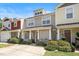 Inviting townhouse showcasing a cozy porch, lush landscaping, and a well-maintained facade under a clear blue sky at 4807 Landover Charge Ln, Raleigh, NC 27616