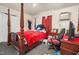 Bedroom featuring a four-poster bed, carpet, and natural light at 501 Magnolia Dr, Rocky Mount, NC 27801