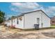 Rear exterior view of a multi-unit home showcasing backyard and basic amenities at 501 Magnolia Dr, Rocky Mount, NC 27801