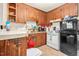 Functional kitchen with wooden cabinetry, appliances, and ample counter space at 501 Magnolia Dr, Rocky Mount, NC 27801