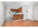 View of kitchen with wood cabinets and a rustic wooden bar counter at 501 Magnolia Dr, Rocky Mount, NC 27801