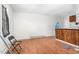 Living room with wood floors, a chair, and a rustic wooden bar counter at 501 Magnolia Dr, Rocky Mount, NC 27801