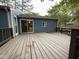 Large wooden deck with sliding glass door entry to house at 507 Holtz Ln, Cary, NC 27511