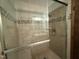 Shower showcasing a tiled interior, glass door, and convenient showerhead at 507 Holtz Ln, Cary, NC 27511