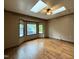 Sunlit bedroom with hardwood floors, a ceiling fan, and a bay window at 507 Holtz Ln, Cary, NC 27511