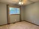 Bedroom featuring window, neutral walls and carpet, with a ceiling fan at 507 Holtz Ln, Cary, NC 27511