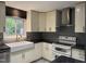 Well-appointed kitchen with custom cabinets, granite countertops, and modern stainless steel appliances at 507 Holtz Ln, Cary, NC 27511