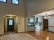Open-concept living room with access to entryway, modern kitchen and dining room at 507 Holtz Ln, Cary, NC 27511