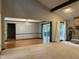 Open living room with vaulted ceiling, fireplace, hardwood floors, and abundant natural light at 507 Holtz Ln, Cary, NC 27511