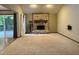 Cozy living room featuring a stone fireplace, hardwood floors, and sliding glass doors at 507 Holtz Ln, Cary, NC 27511