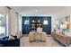 Bright home office with modern decor, featuring a stylish desk, shelving, and comfortable seating area at 515 Claftin St, Sanford, NC 27330