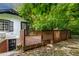 Wooden back deck with lattice railing, providing a private outdoor space with nearby shade trees at 519 W Raleigh St, Siler City, NC 27344