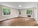 Spacious bedroom featuring hardwood floors, natural light, and neutral tones at 519 W Raleigh St, Siler City, NC 27344
