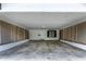 Spacious carport with lattice accents, offering ample covered parking, and a door to the home at 519 W Raleigh St, Siler City, NC 27344
