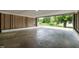 View from the carport, showcasing its lattice design and the driveway leading to the street at 519 W Raleigh St, Siler City, NC 27344