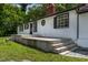 A nice house with an elevated concrete patio and steps, featuring a combination of charm and character at 519 W Raleigh St, Siler City, NC 27344
