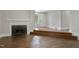 Living room features a fireplace, hardwood floors and a multi-level layout at 519 W Raleigh St, Siler City, NC 27344