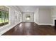 Inviting living room featuring hardwood floors, light-filled windows, and French doors at 519 W Raleigh St, Siler City, NC 27344