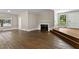 Beautiful living room boasting hardwood floors, fireplace, and large windows at 519 W Raleigh St, Siler City, NC 27344