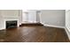 Bright and airy living room with a cozy fireplace and hardwood floors at 519 W Raleigh St, Siler City, NC 27344