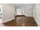 Living room boasts hardwood floors, light walls, and French doors at 519 W Raleigh St, Siler City, NC 27344