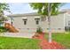 Exterior view of the home featuring a patio, wood stairs, and landscaped backyard at 5233 Greymoss Ln, Apex, NC 27539