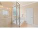 Bright bathroom featuring a glass shower and a large soaking tub at 5233 Greymoss Ln, Apex, NC 27539