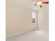 Bedroom featuring neutral colored walls, carpet, window and ceiling fan at 5233 Greymoss Ln, Apex, NC 27539