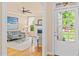 Cozy living room with hardwood floors, fireplace, and abundant natural light at 5233 Greymoss Ln, Apex, NC 27539