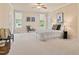 Spacious main bedroom with neutral tones, lots of light, and large windows at 5233 Greymoss Ln, Apex, NC 27539