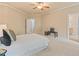 Spacious main bedroom with neutral tones, lots of light, and walk in closet to bathroom at 5233 Greymoss Ln, Apex, NC 27539