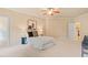 Spacious main bedroom with neutral tones, lots of light, and walk in closet at 5233 Greymoss Ln, Apex, NC 27539