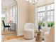 Comfortable sitting area with lots of light and a small table to hold drinks at 5233 Greymoss Ln, Apex, NC 27539