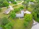 Aerial view of home with lush landscaping, long driveway, and charming neighborhood at 5804 Heathill Ct, Raleigh, NC 27603