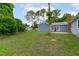 Expansive backyard with mature trees, shed, and patio, perfect for outdoor entertaining at 5804 Heathill Ct, Raleigh, NC 27603