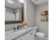 Bathroom features a granite vanity, modern lighting, and white tile at 5804 Heathill Ct, Raleigh, NC 27603